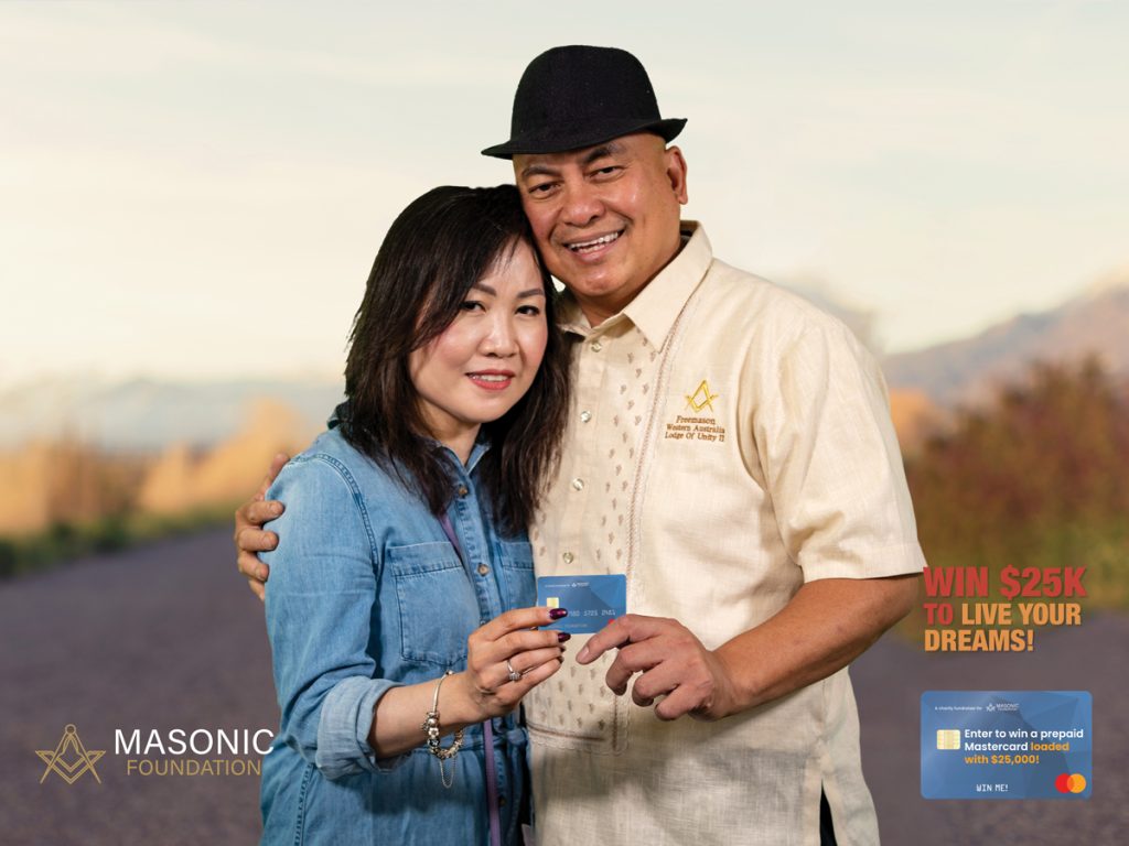 Woman and man holding credit card prize